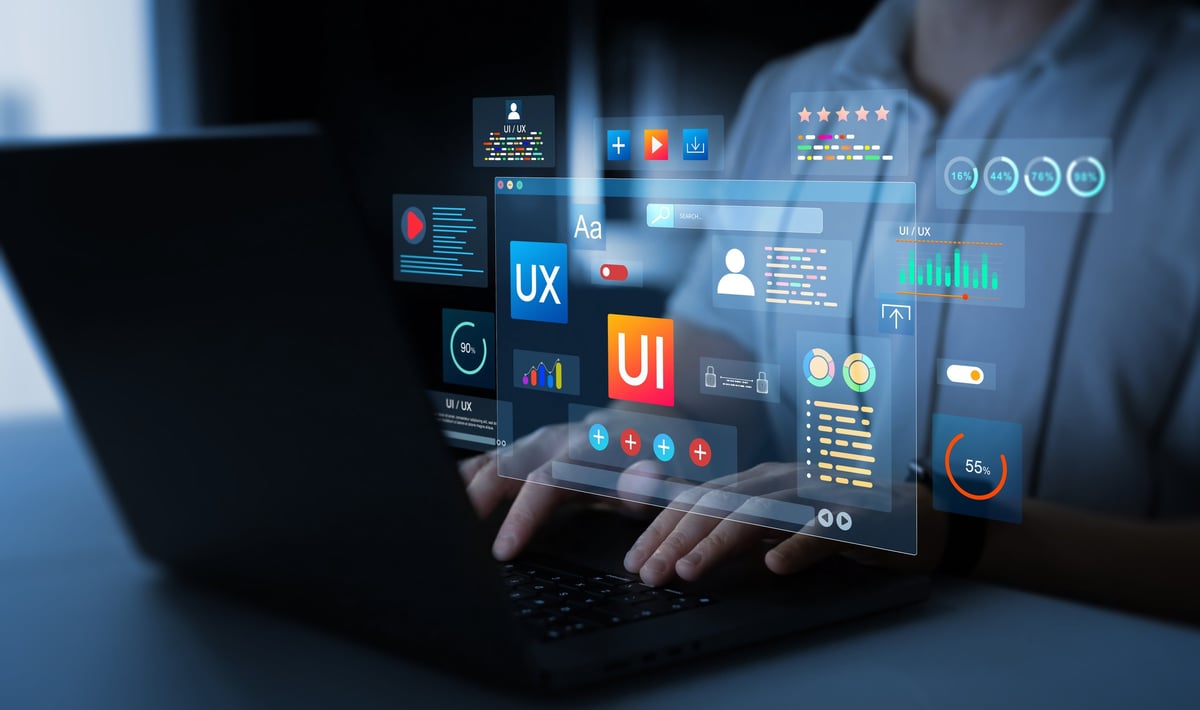 Creative designer planning website design with holographic UI elements
